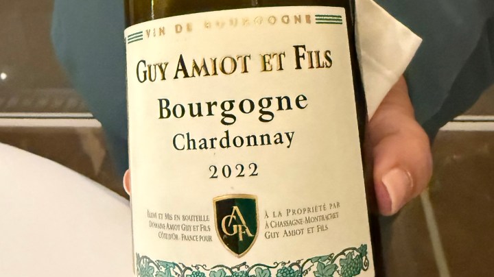 A close-up of a wine bottle label featuring 'Guy Amiot et Fils Bourgogne Chardonnay 2022'.